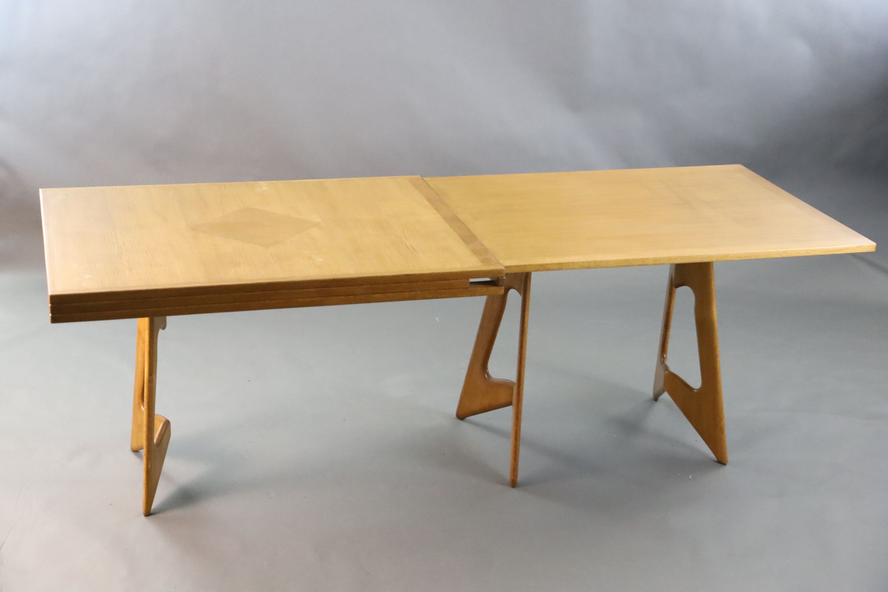 A Guillerme & Chambron golden oak draw leaf dining table, W.3ft 7in. D.2ft 9in. when closed, H.2ft 5in.